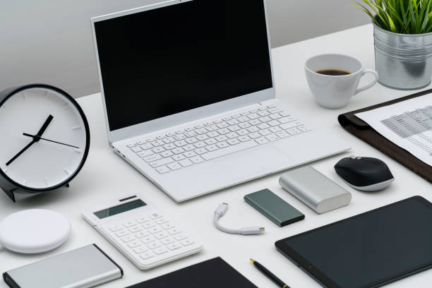 Flat lay of office desktop and gadgets at an angle
